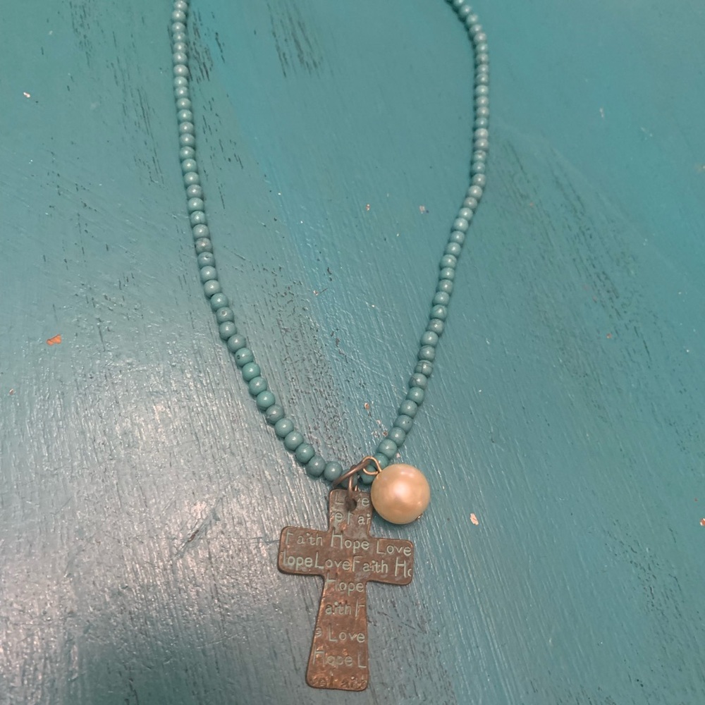 Turquoise necklace with bronze cross